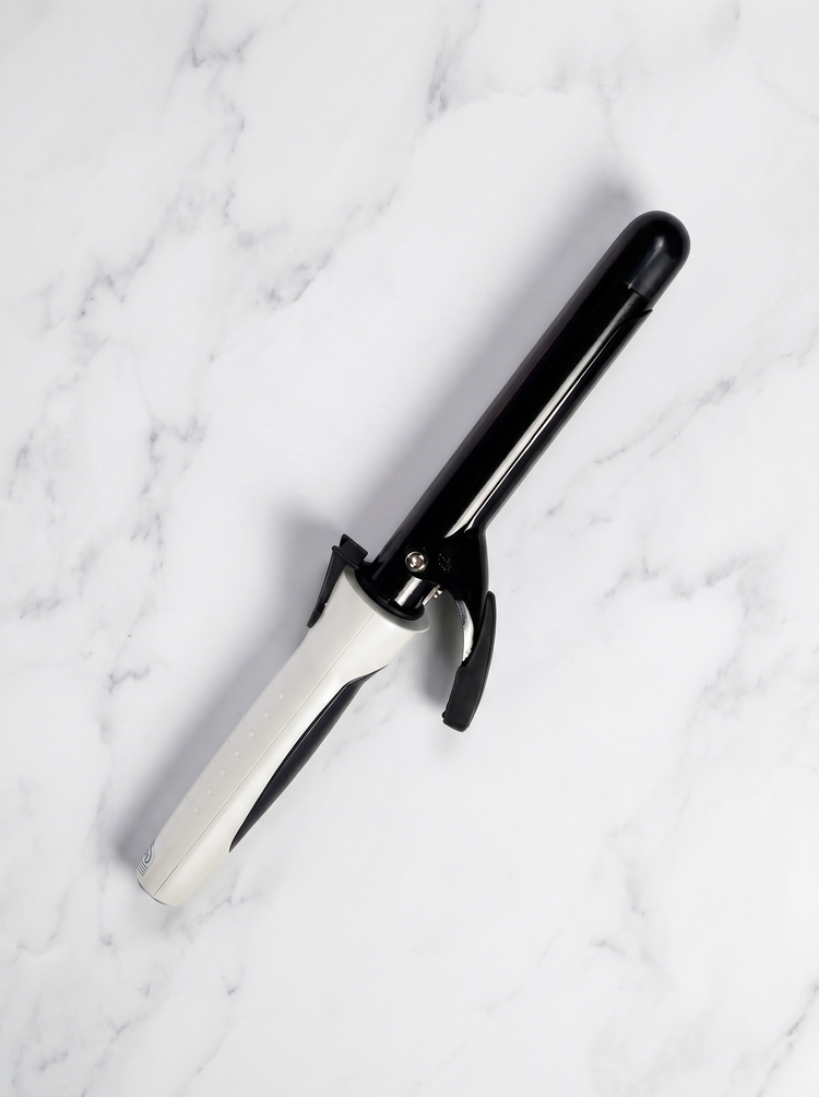 Amstar curling irons on white marble